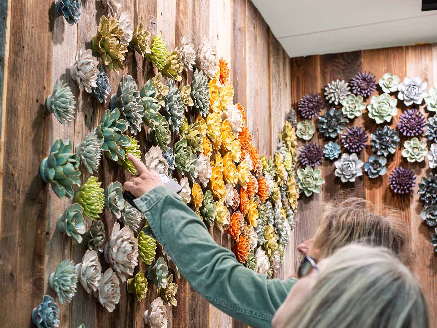 Chive at the RHS Chelsea Flower Show 2026, featuring a wall of ceramic flowers