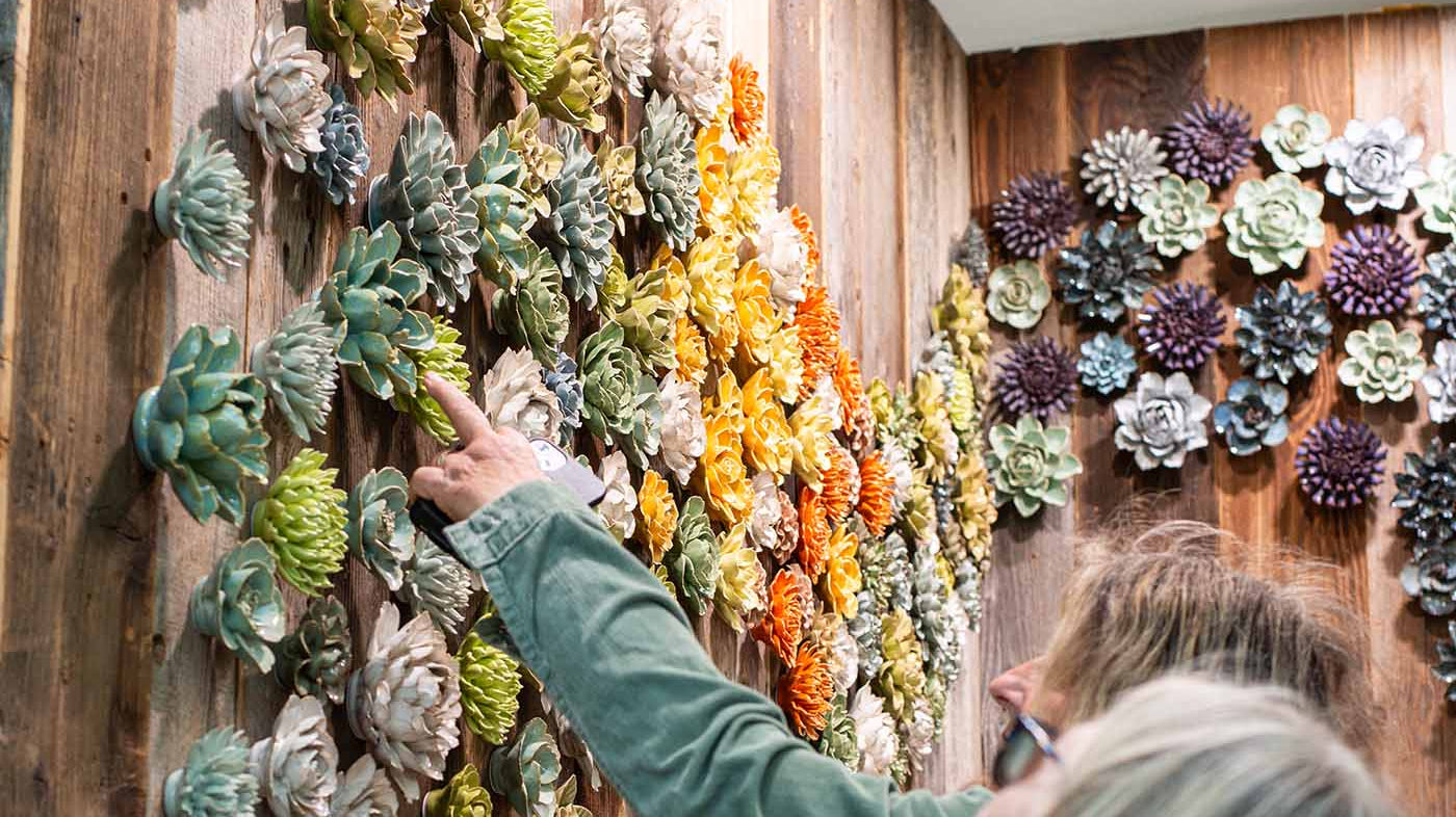 Chive at the RHS Chelsea Flower Show 2026, featuring a wall of ceramic flowers