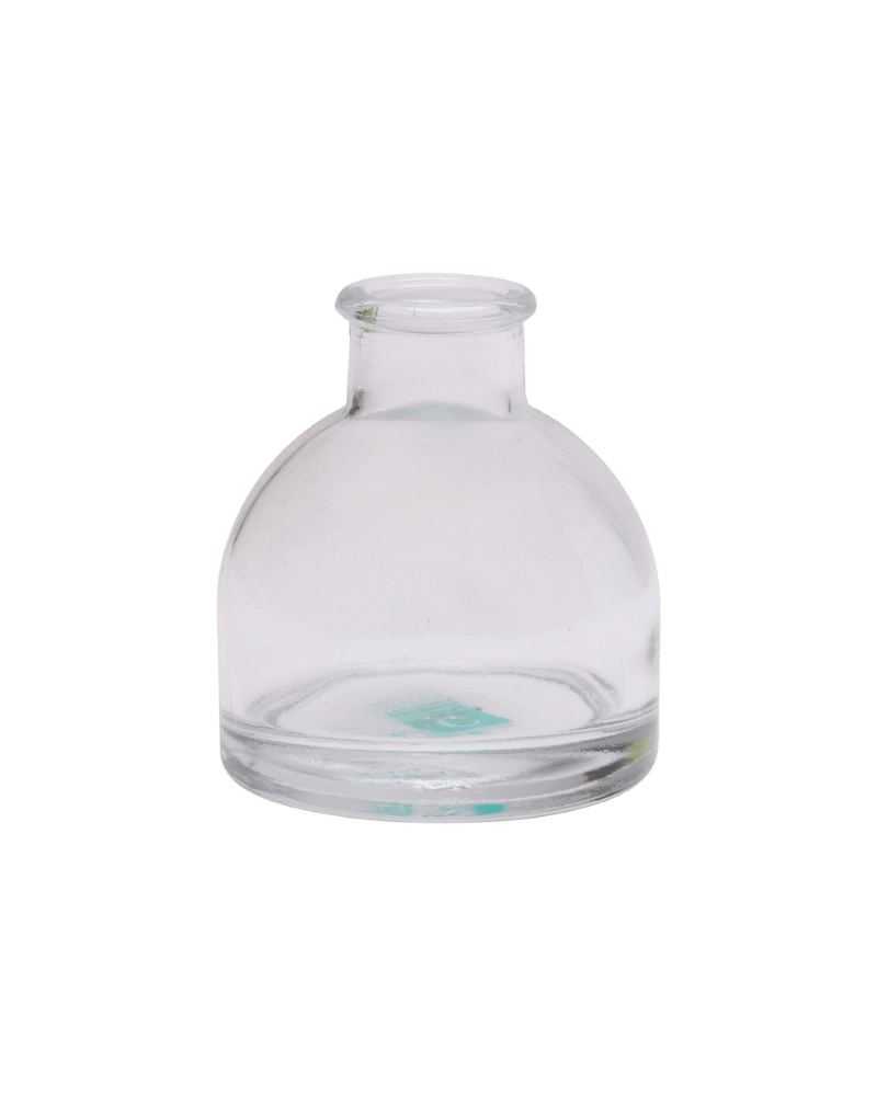 Chive Loft round glass bud vase in clear glass with a domed silhouette and short neck.