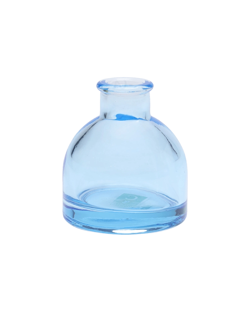 Chive Loft round glass bud vase in light blue with a domed silhouette and short neck.
