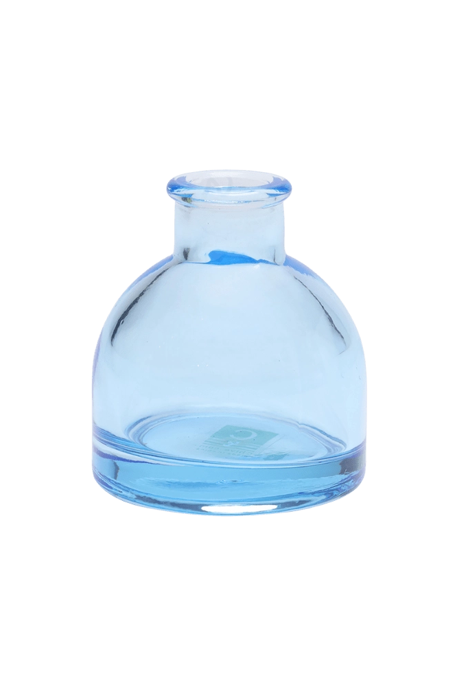 Chive Loft round glass bud vase in light blue with a domed silhouette and short neck.