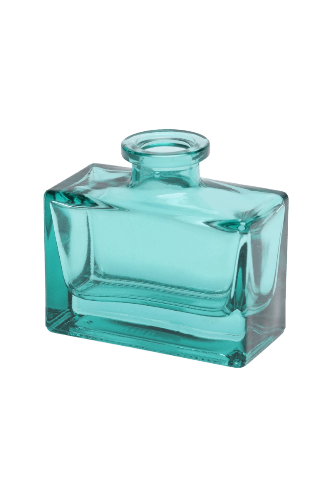 Chive Loft glass bud vase in Teal rotates to reveal the rectangular jar's angled corner detail.