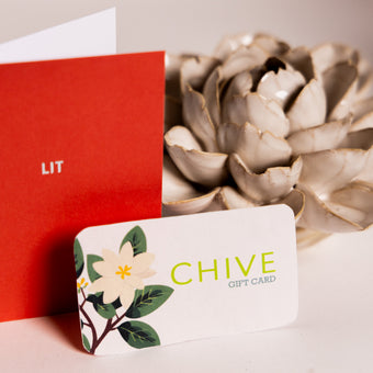 Chive Studio gift card with floral design displayed with succulent — Chive Studio