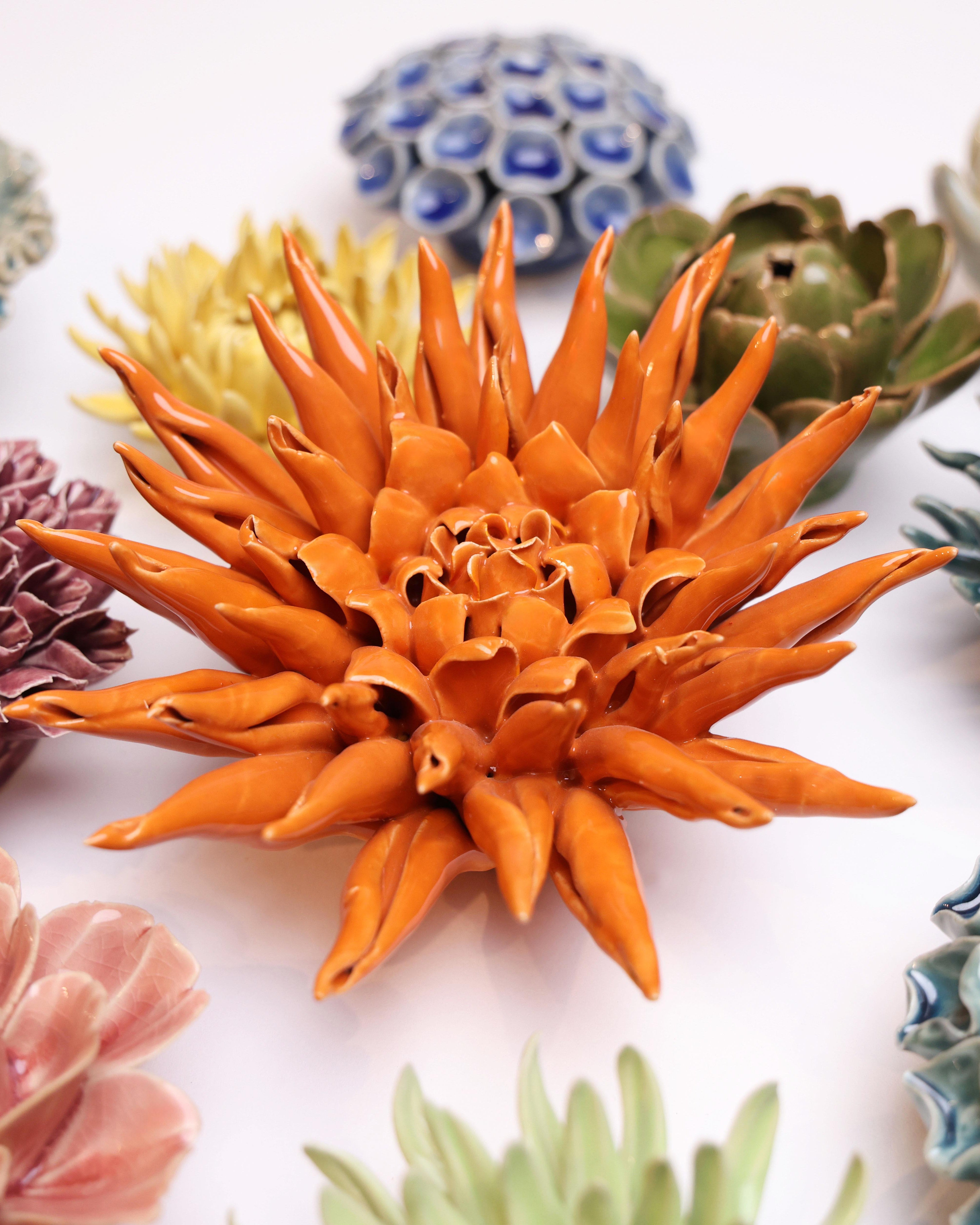 Ceramic Flower Large Orange 12 ceramic wall flower styled on wall — Classic Collection — Chive Studio Toronto