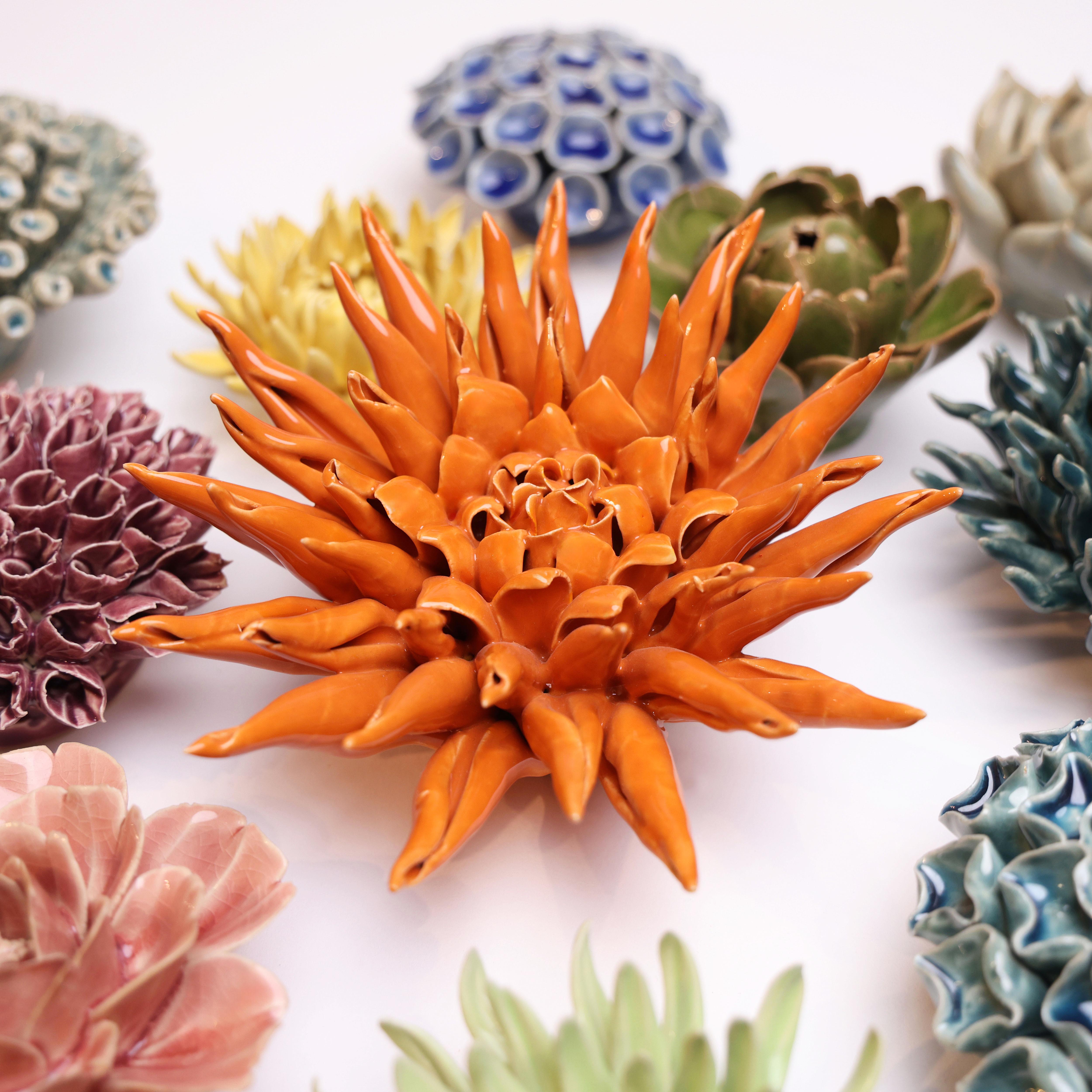 Ceramic Flower Large Orange 12 ceramic wall flower styled on wall — Classic Collection — Chive Studio Toronto
