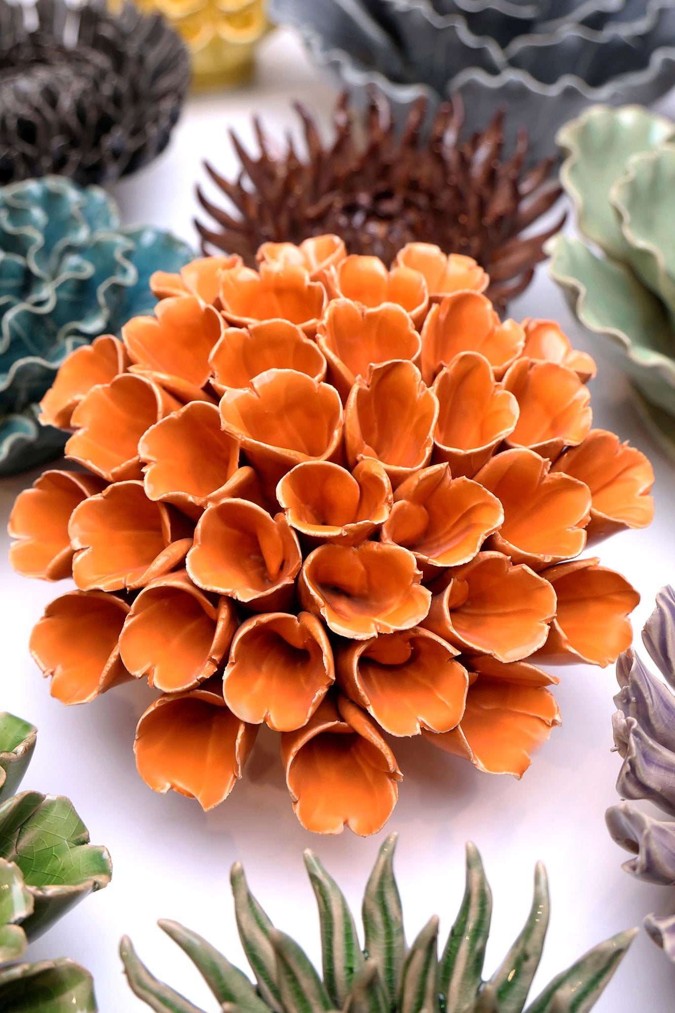 Ceramic Flower Polyp Orange Large ceramic wall flower styled on wall — Classic Collection — Chive Studio Toronto