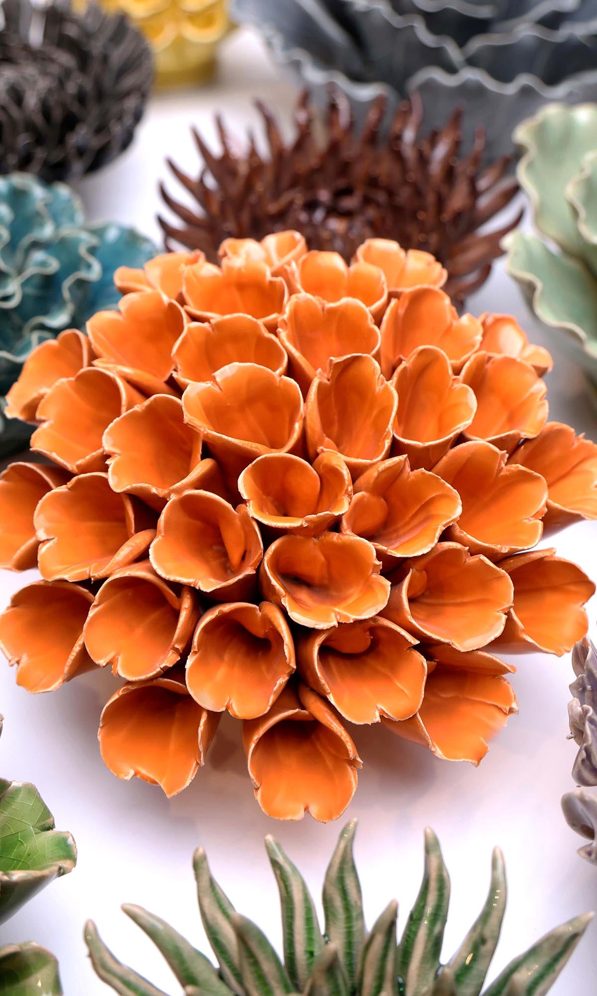 Ceramic Flower Polyp Orange Large ceramic wall flower styled on wall — Classic Collection — Chive Studio Toronto