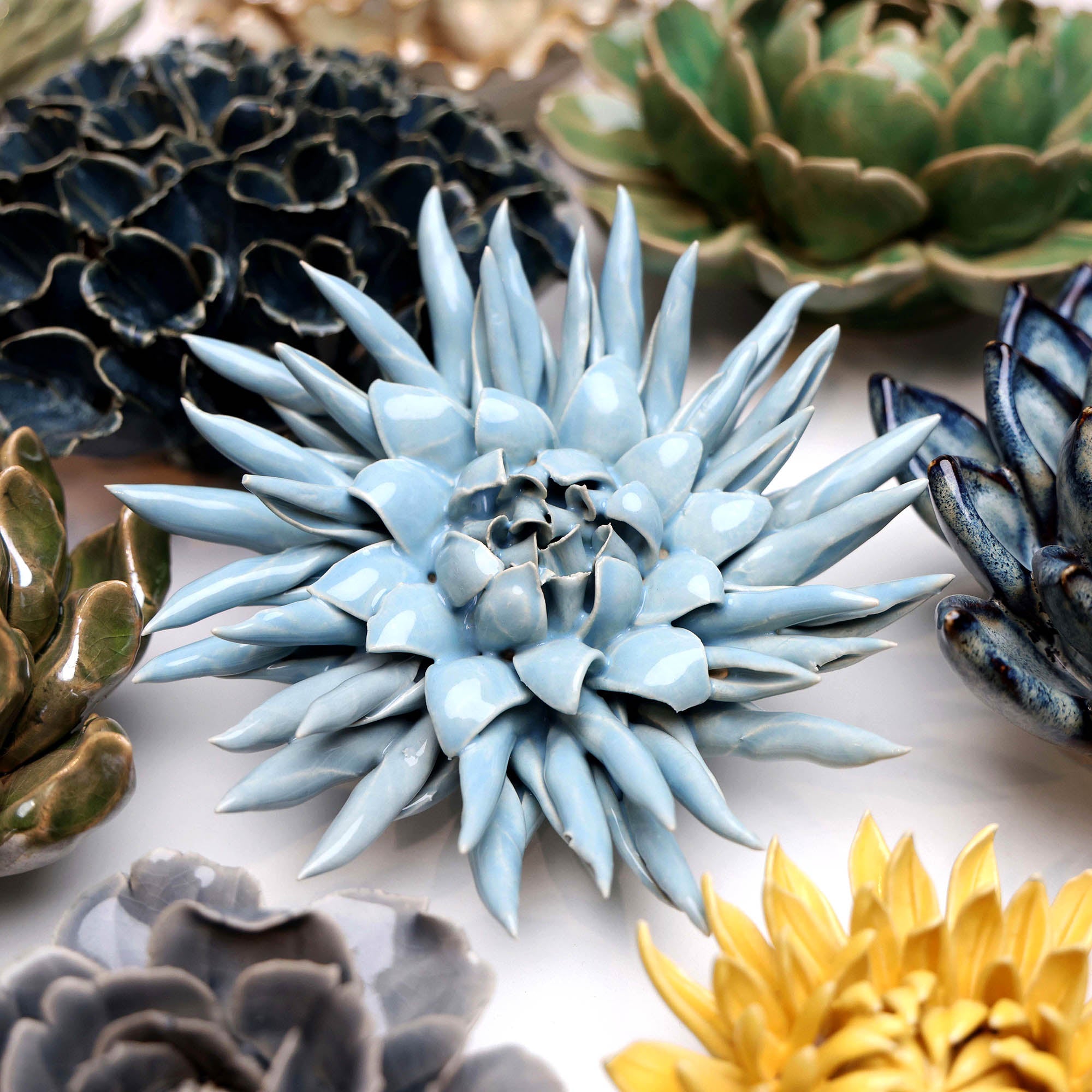 Flower Blue 6 ceramic wall flower styled on wall — Classic Collection — Chive Studio Toronto