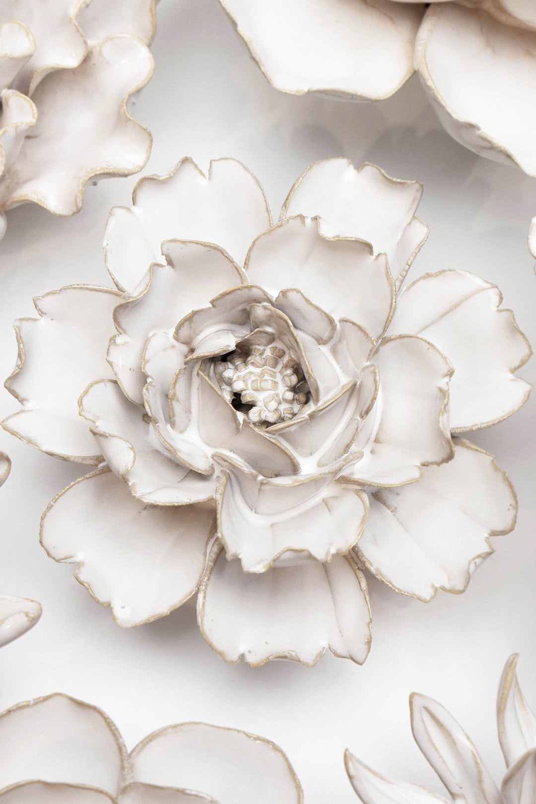 Ivory Rose ceramic wall flower ceramic wall flower styled on a white table with other flowers — Chive Studio