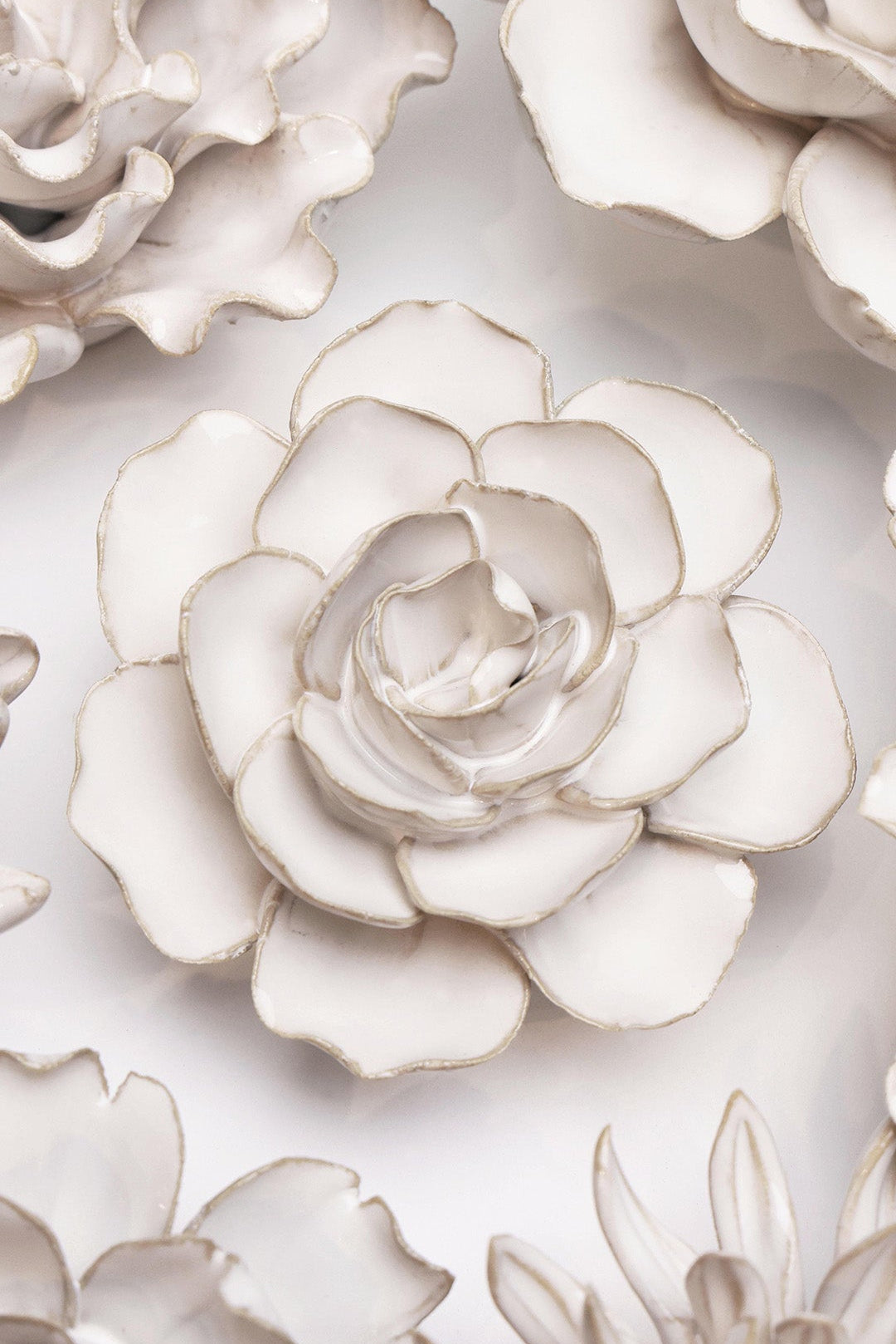 Ivory Amandine Ranunculus ceramic wall flower styled on wall — Coastal Collection — Chive Studio Toronto