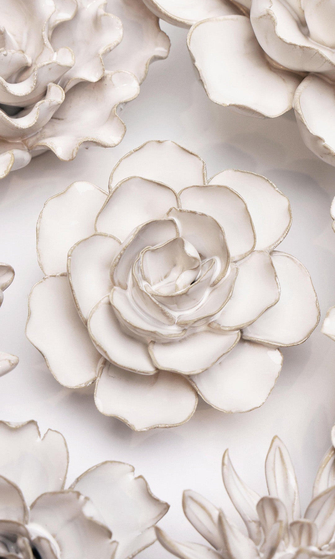 Ivory Amandine Ranunculus ceramic wall flower styled on wall — Coastal Collection — Chive Studio Toronto