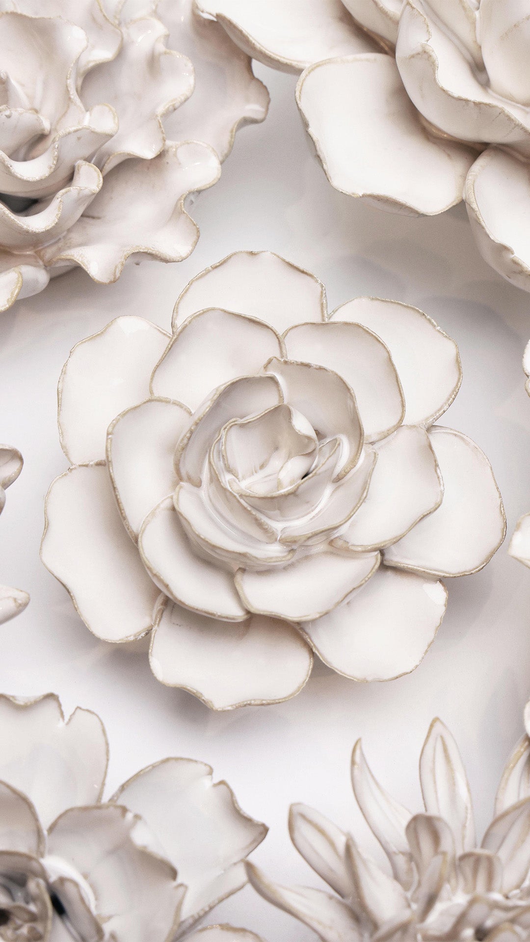 Ivory Amandine Ranunculus ceramic wall flower styled on wall — Coastal Collection — Chive Studio Toronto
