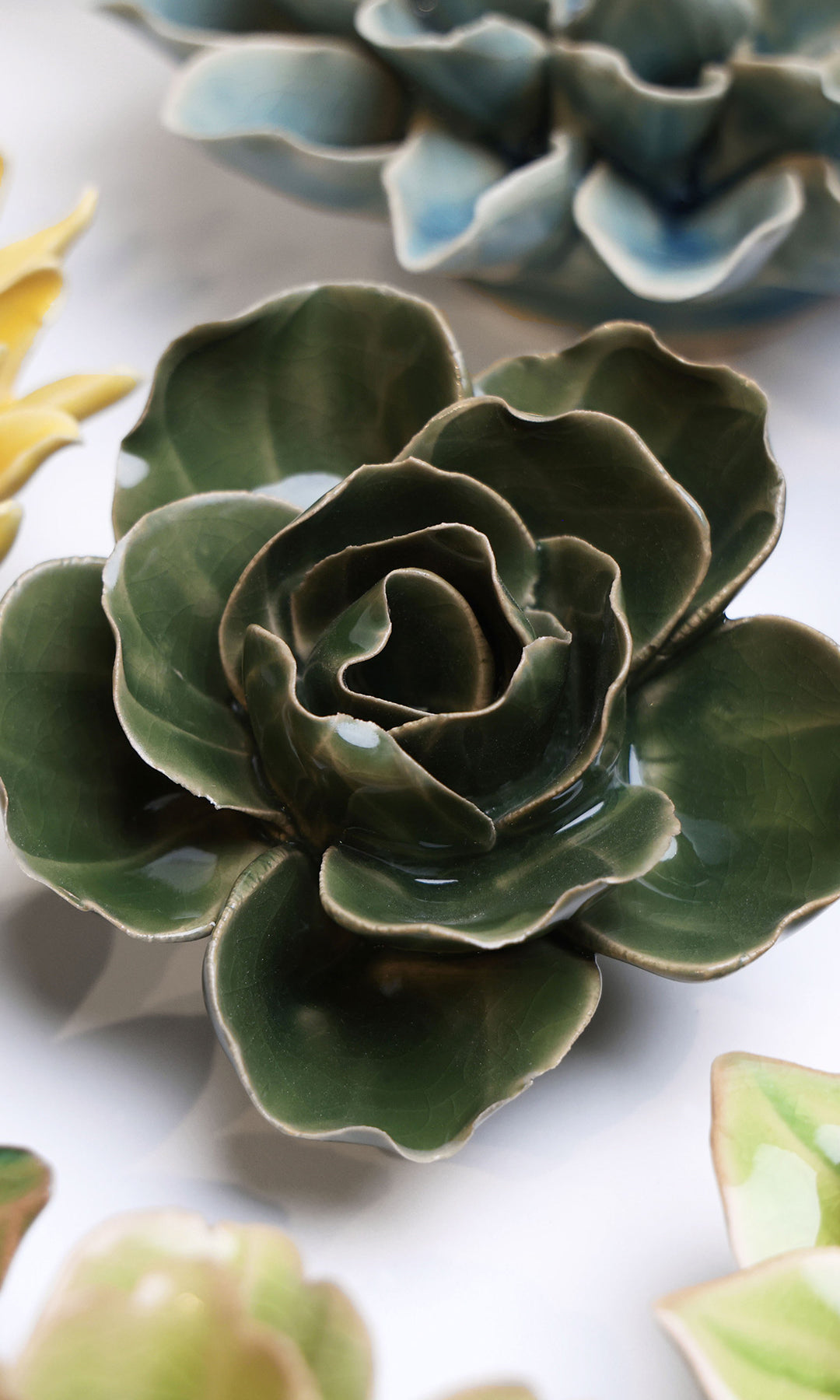 Fir Green Butterfly Ranunculus ceramic wall flower styled on wall — English Garden — Chive Studio Toronto