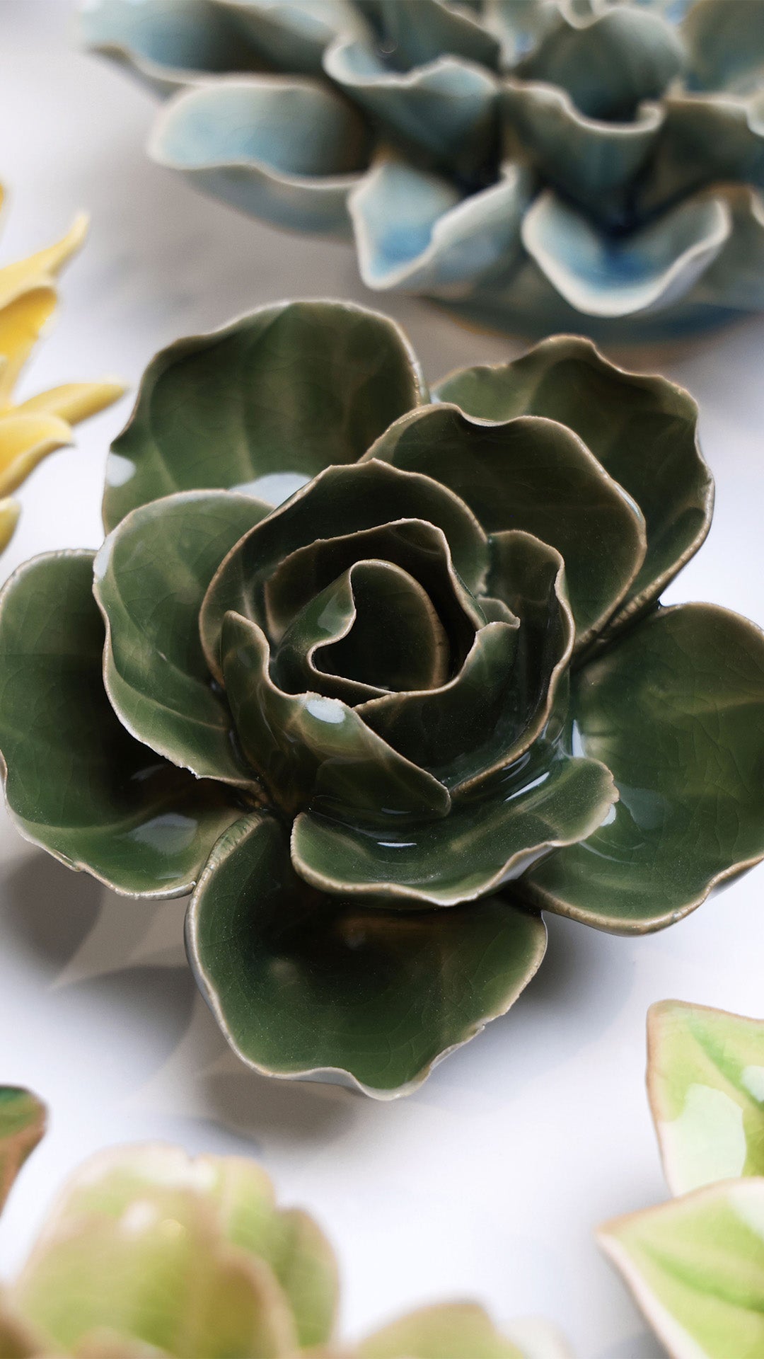 Fir Green Butterfly Ranunculus ceramic wall flower styled on wall — English Garden — Chive Studio Toronto