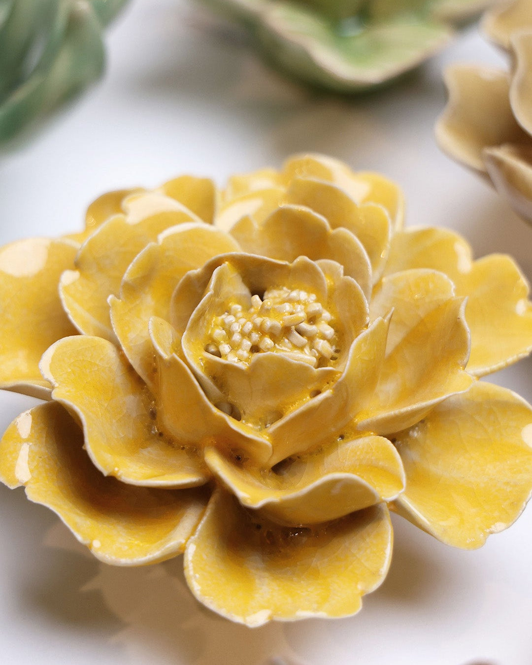 Burnt Yellow Rose ceramic wall flower styled on wall — English Garden — Chive Studio Toronto