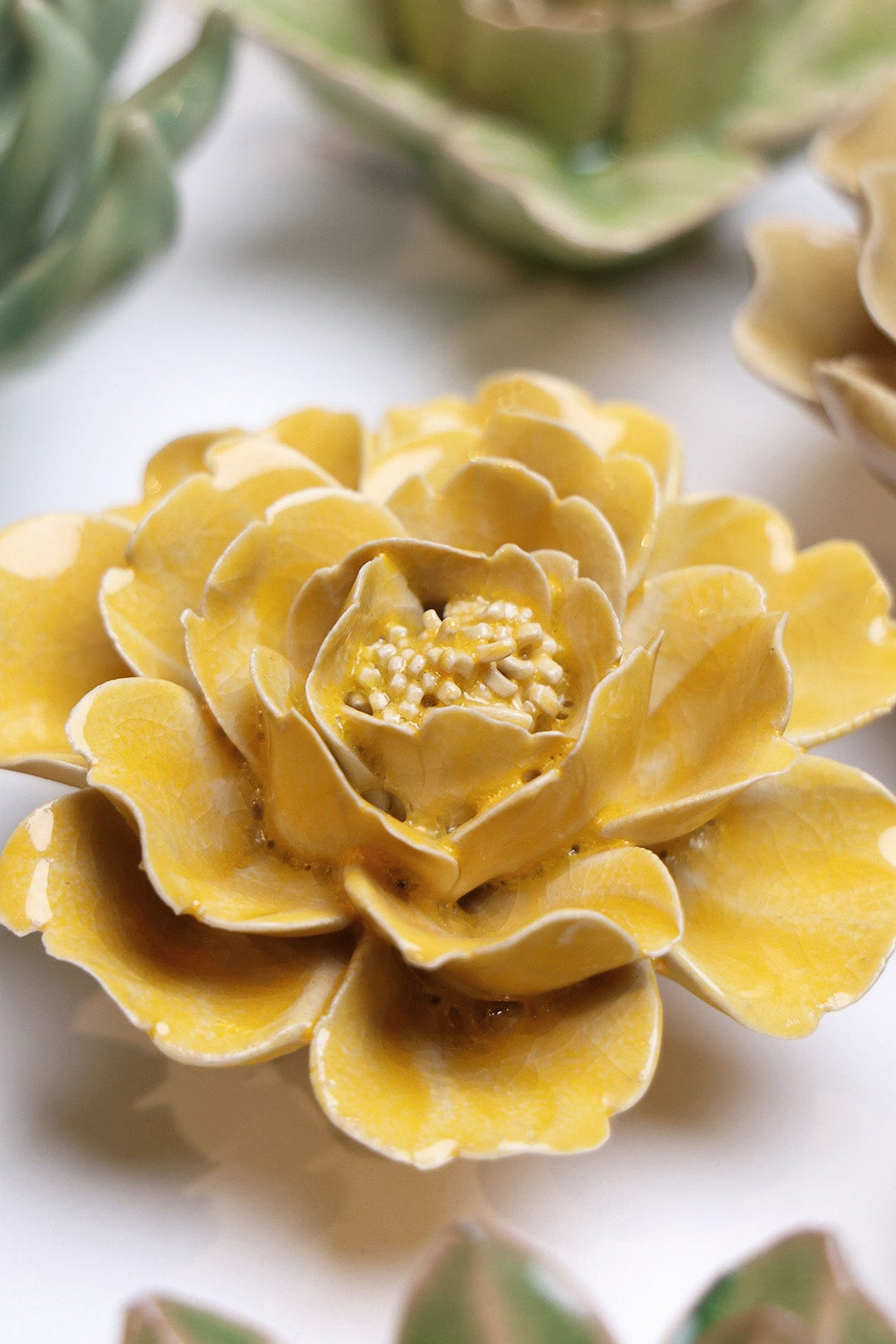 Burnt Yellow Rose ceramic wall flower styled on wall — English Garden — Chive Studio Toronto