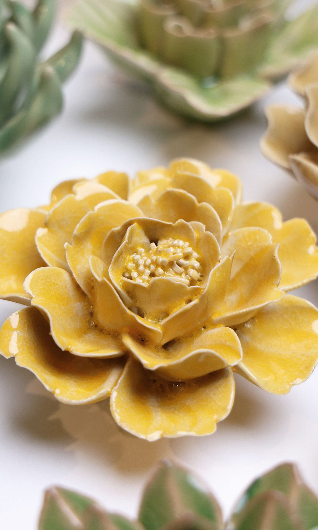 Burnt Yellow Rose ceramic wall flower styled on wall — English Garden — Chive Studio Toronto