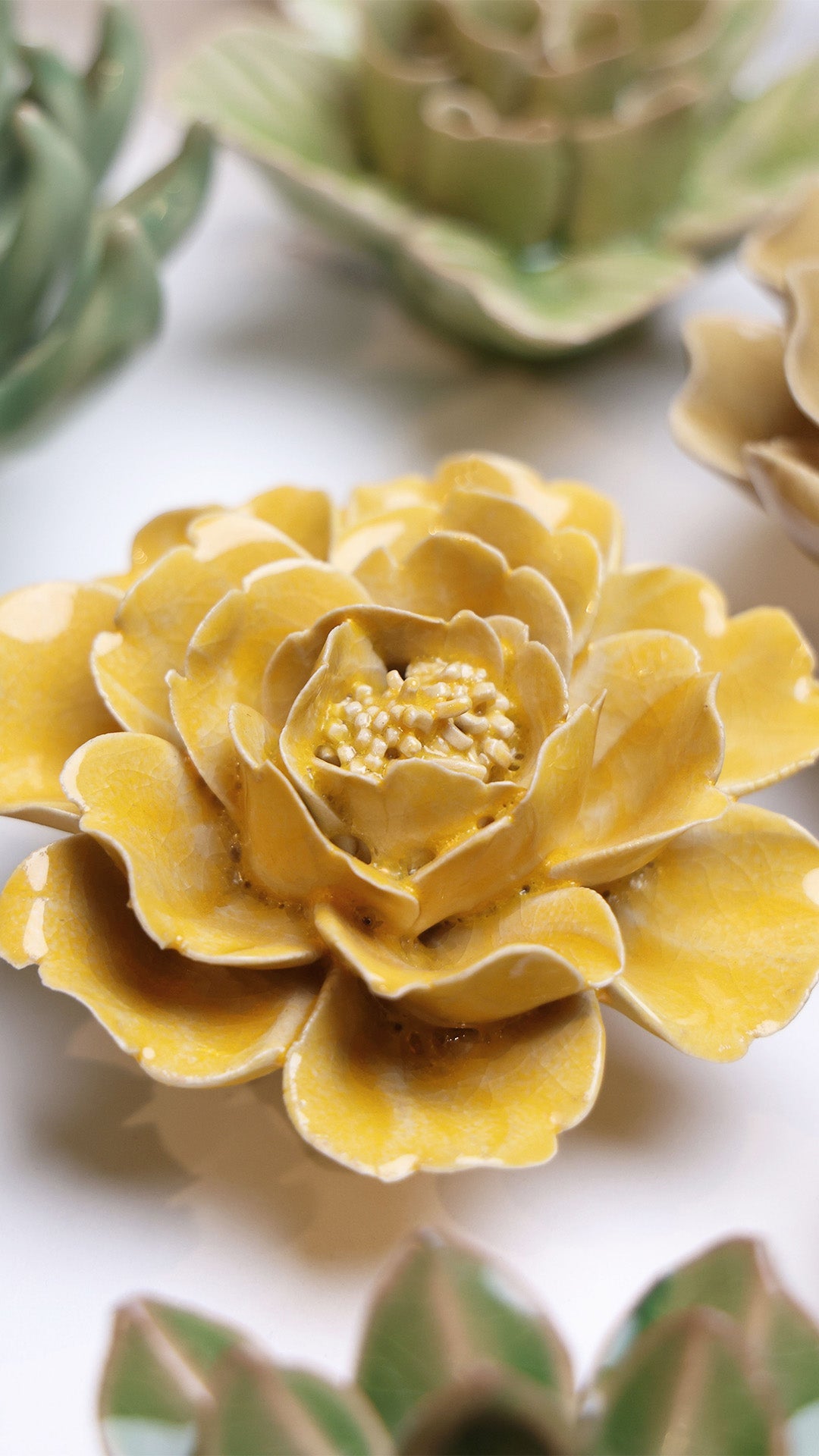 Burnt Yellow Rose ceramic wall flower styled on wall — English Garden — Chive Studio Toronto