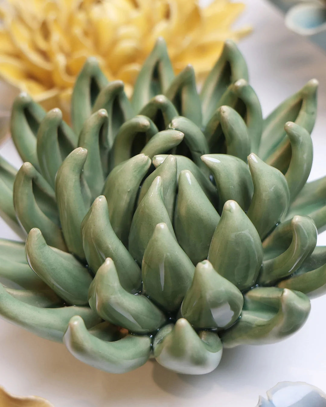 Jade Green Succulent ceramic wall flower mounted on a wall — Chive Ceramics Studio