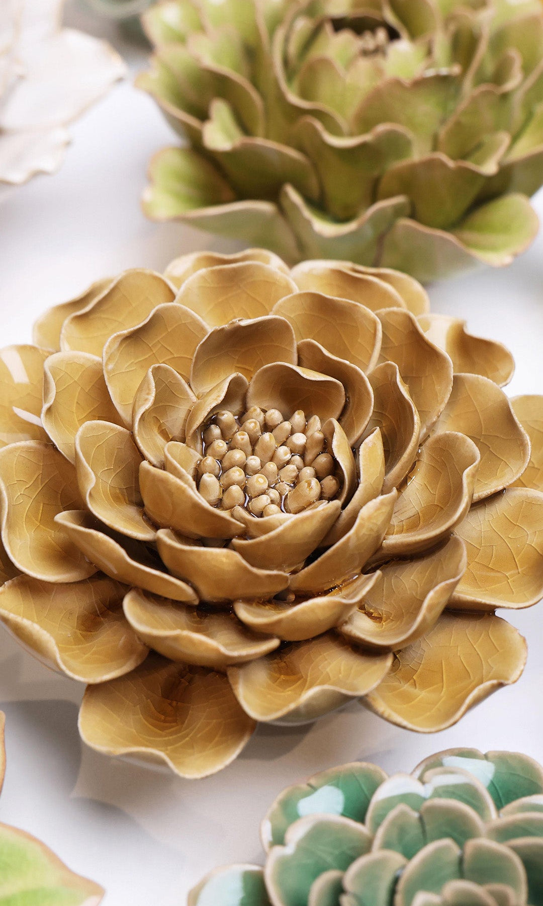 Caramel Charm Peony ceramic wall flower styled on a white table with other flowers — Chive Studio