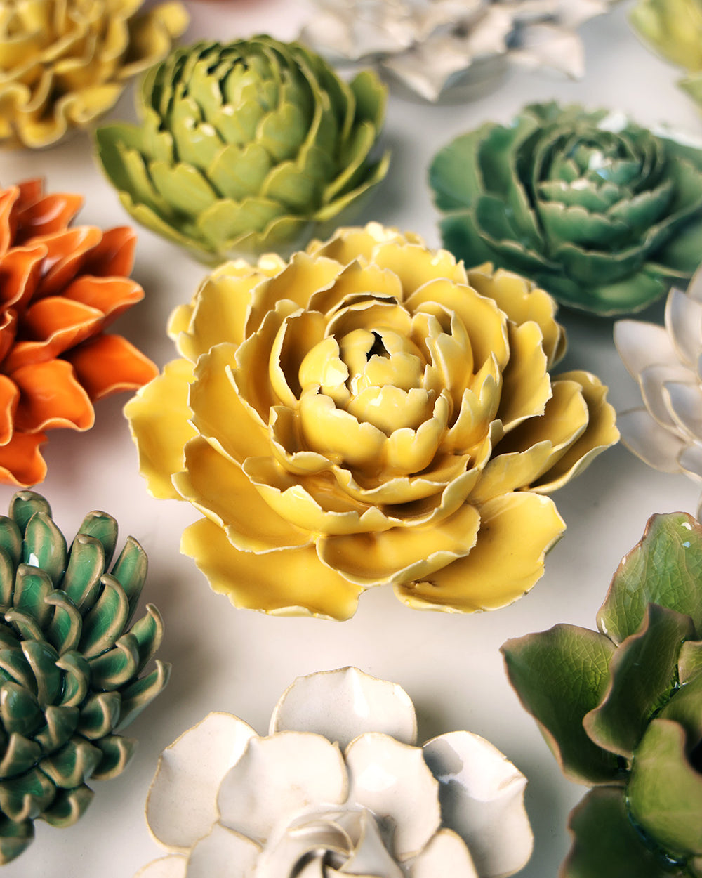 Buttercup Yellow Gay Paree Peony ceramic wall flower mounted on a wall — Chive Ceramics Studio