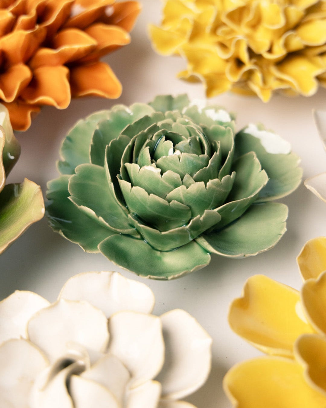 Jade Green English Rose ceramic wall flower mounted on a wall — Chive Ceramics Studio