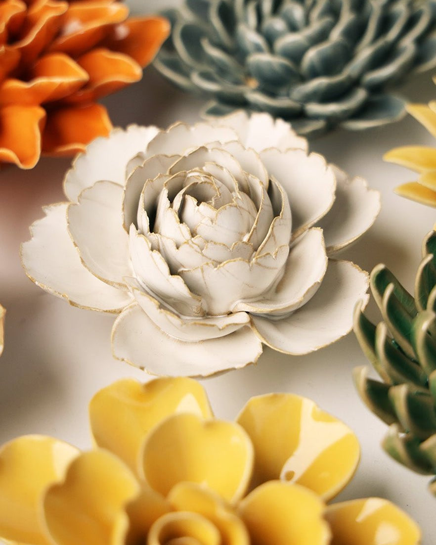 Ivory English Rose ceramic wall flower mounted on a wall — Chive Ceramics Studio