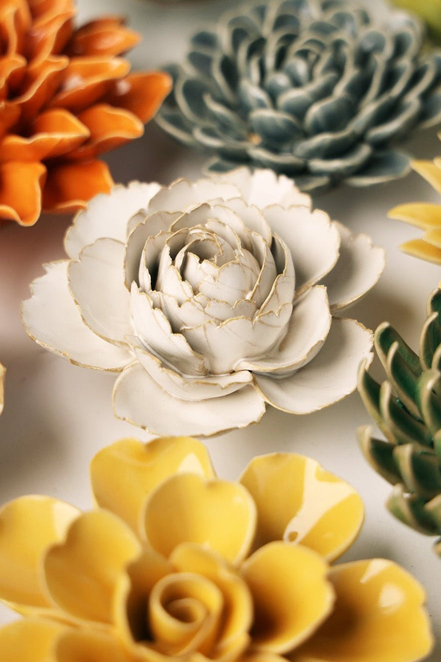 Ivory Rose ceramic wall flower styled on a white table with other flowers — Chive Studio
