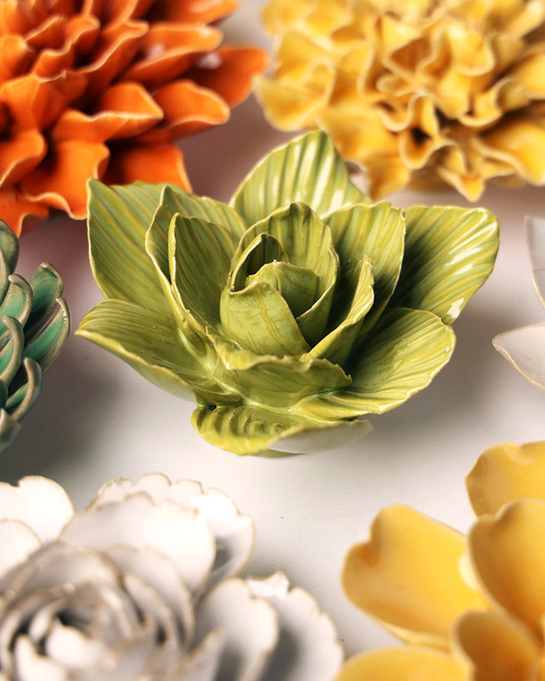 Chartreuse Gladiolus ceramic wall flower mounted on a wall — Chive Ceramics Studio