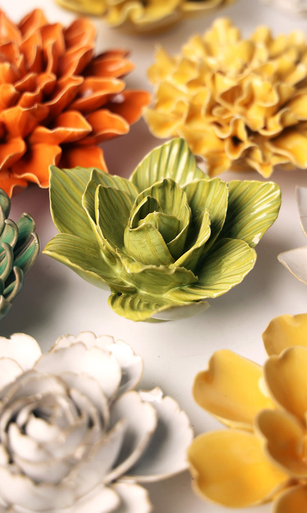 Chartreuse Chartreuse Gladiolus ceramic wall flower styled on a white table with other flowers — Chive Studio
