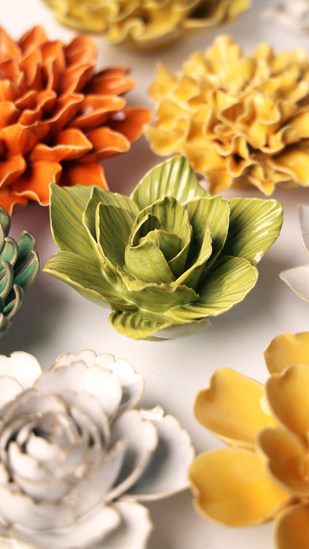 Chartreuse Chartreuse Gladiolus ceramic wall flower styled on a white table with other flowers — Chive Studio