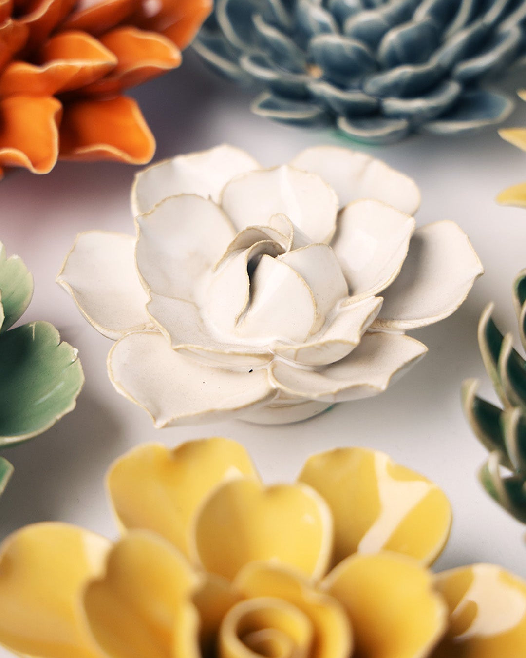 Ivory Daffodil ceramic wall flower mounted on a wall — Chive Ceramics Studio