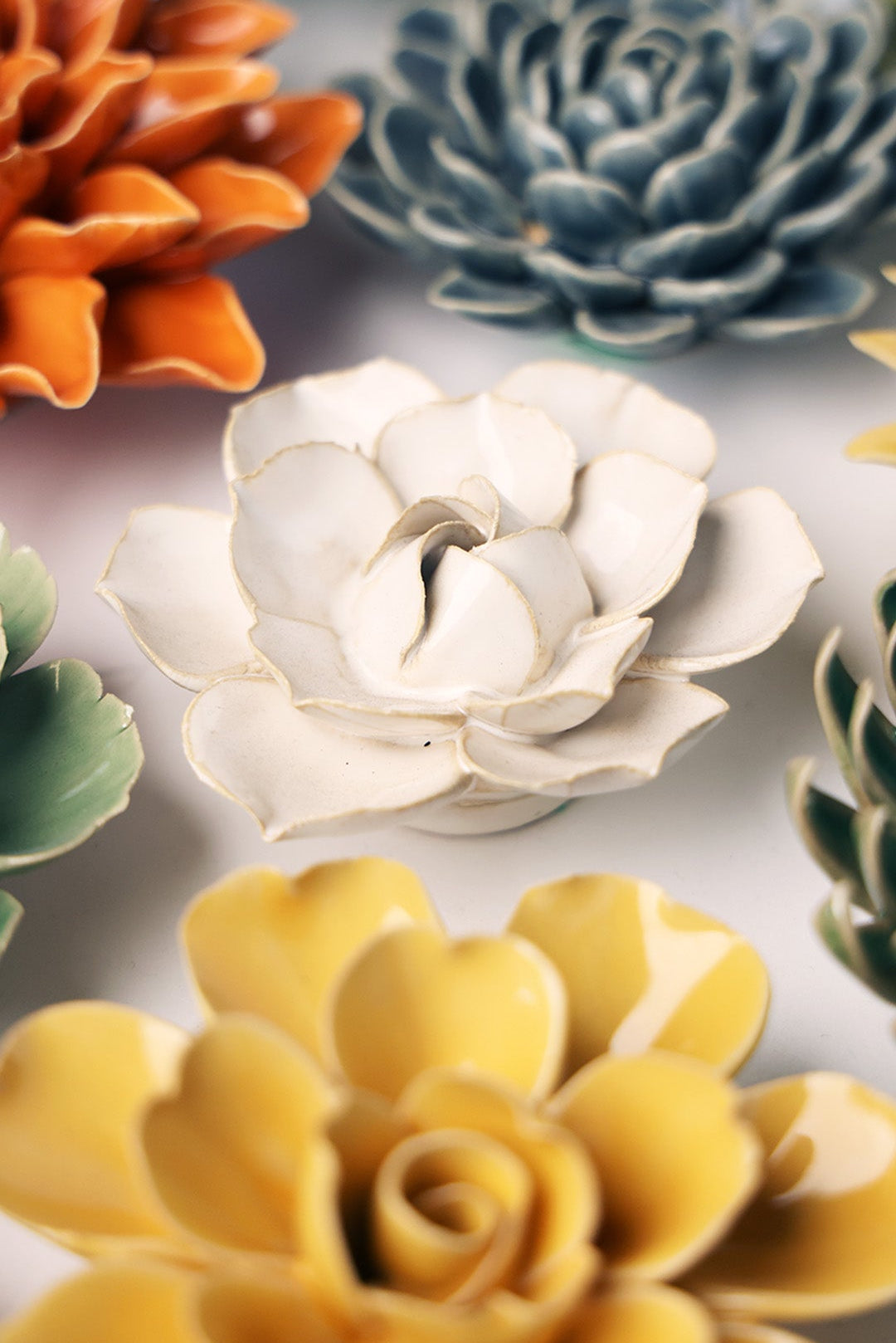 Ivory Daffodil ceramic wall flower mounted on a wall — Chive Ceramics Studio