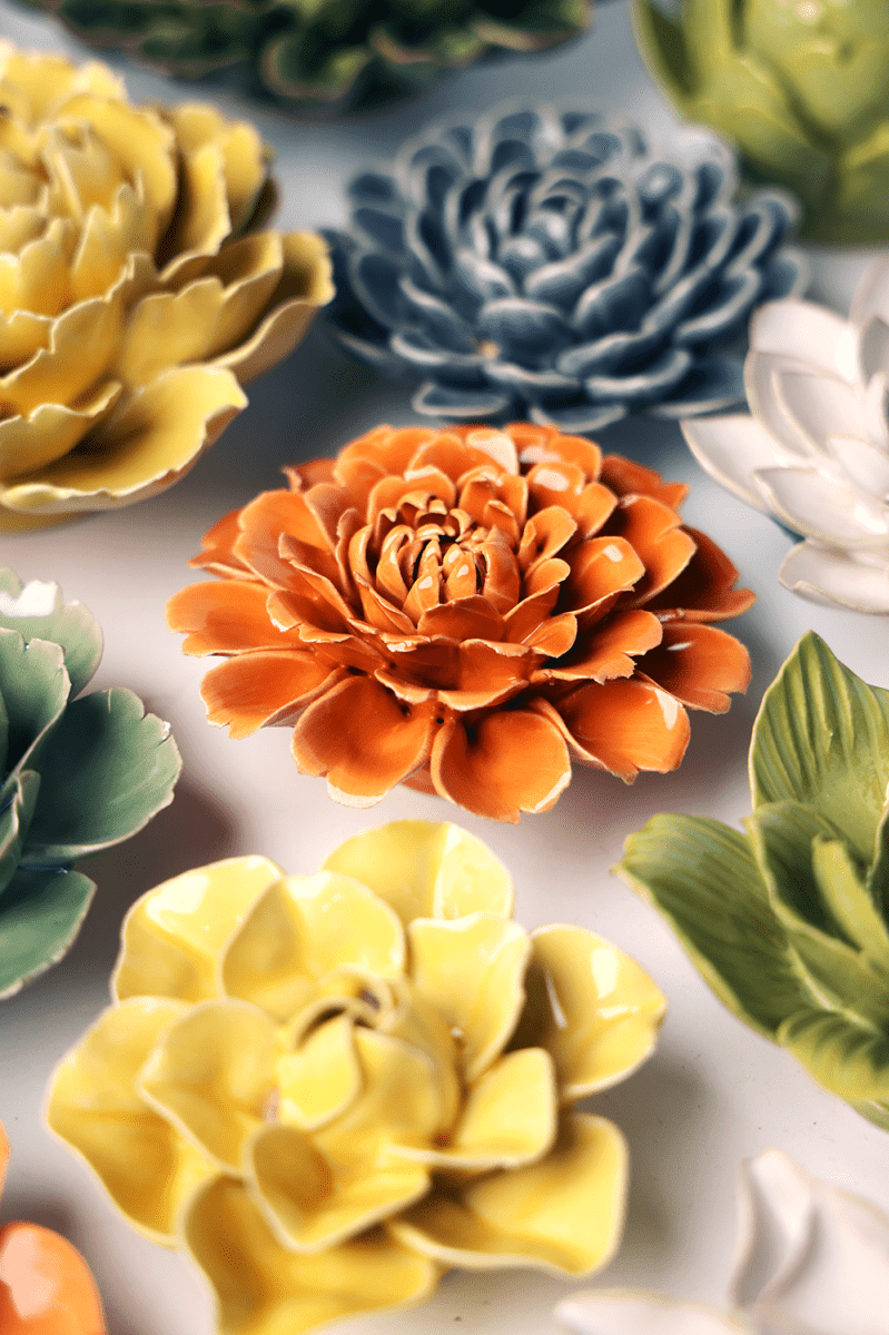 Orange Fiesta Marigold ceramic wall flower styled on wall — English Garden — Chive Studio Toronto
