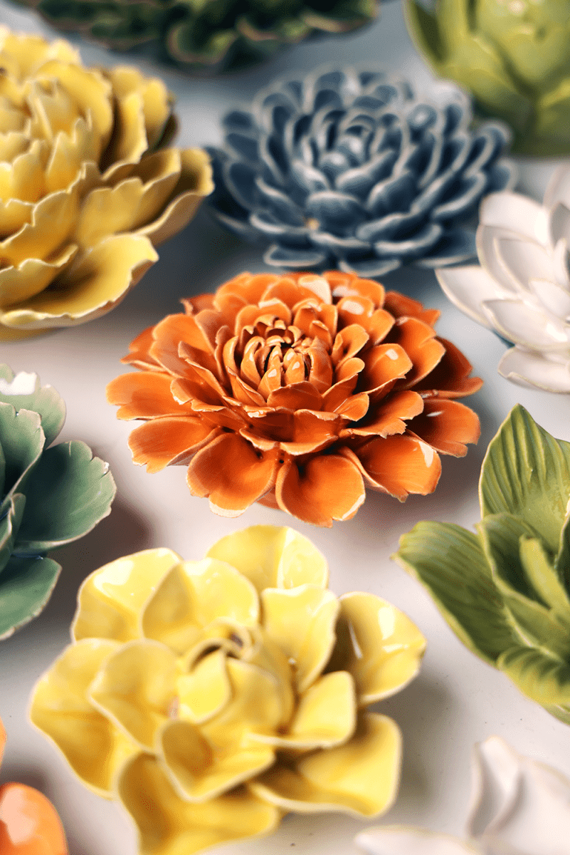 Orange Fiesta Marigold ceramic wall flower styled on wall — English Garden — Chive Studio Toronto