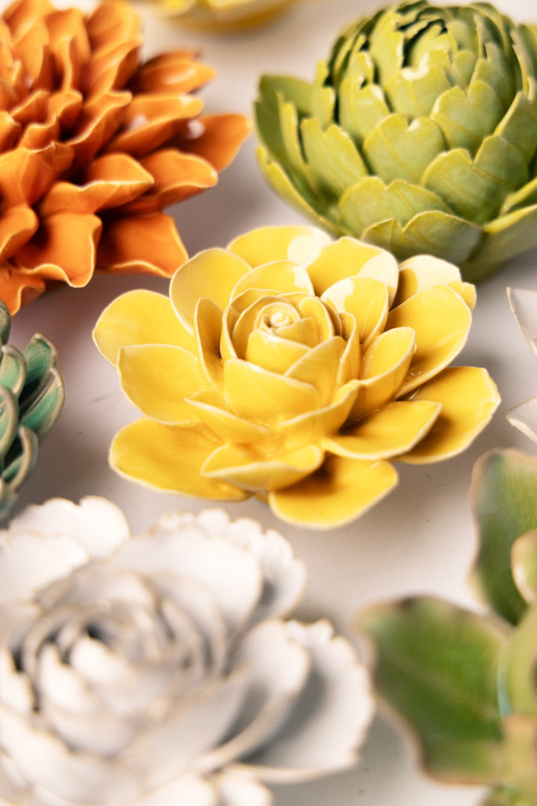 Burnt Yellow Begonia ceramic wall flower styled on wall — English Garden — Chive Studio Toronto