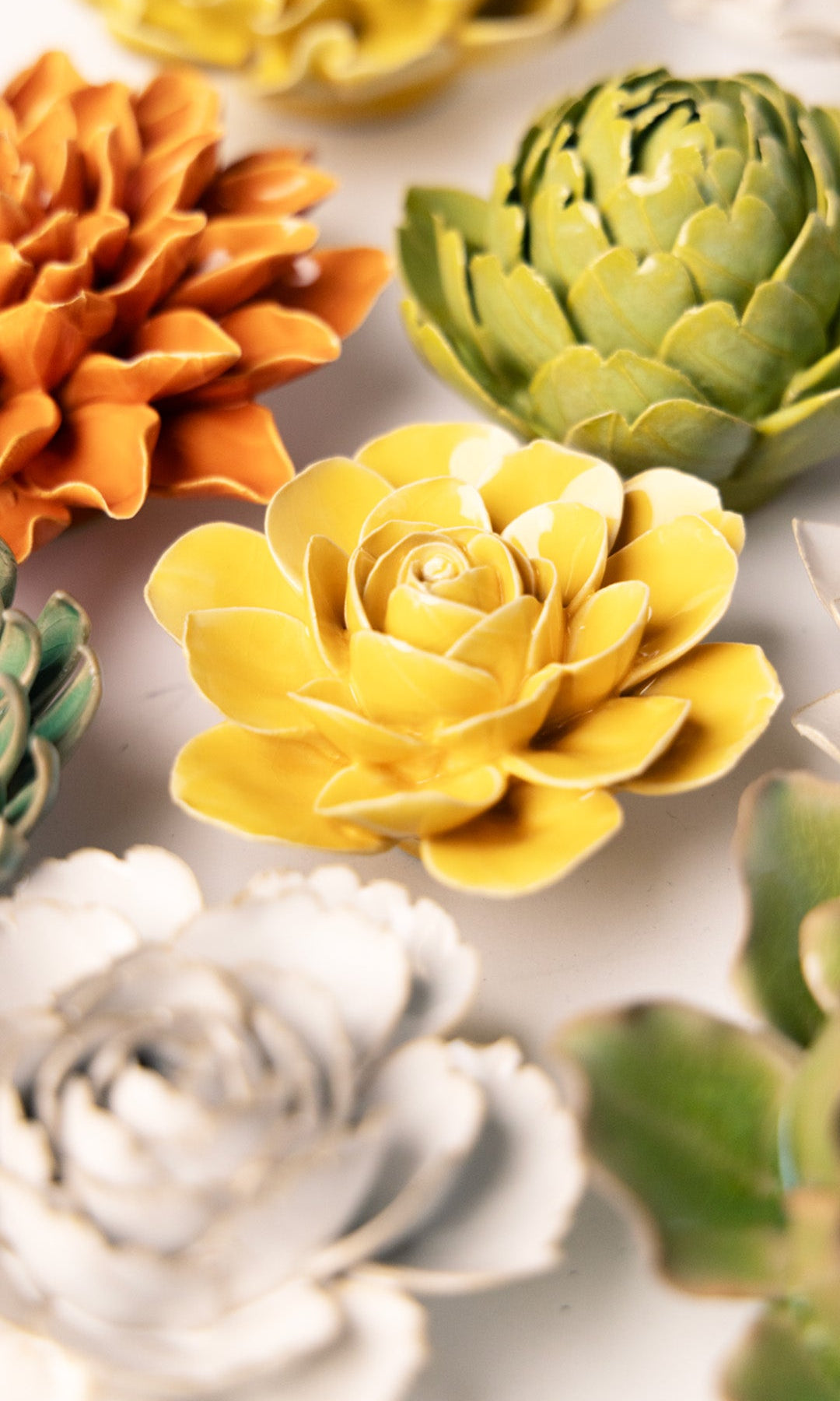 Burnt Yellow Begonia ceramic wall flower styled on wall — English Garden — Chive Studio Toronto