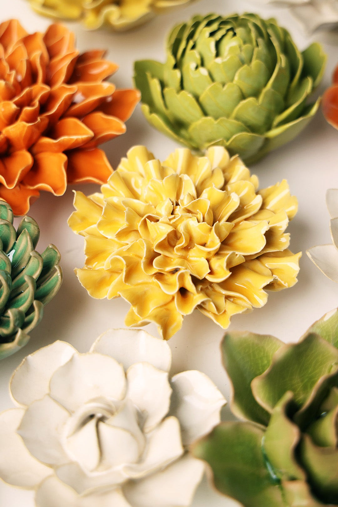 Burnt Yellow Tundra Carnation ceramic wall flower styled on wall — English Garden — Chive Studio Toronto