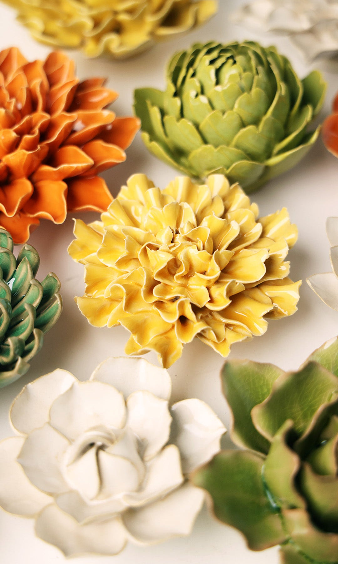 Burnt Yellow Tundra Carnation ceramic wall flower styled on wall — English Garden — Chive Studio Toronto