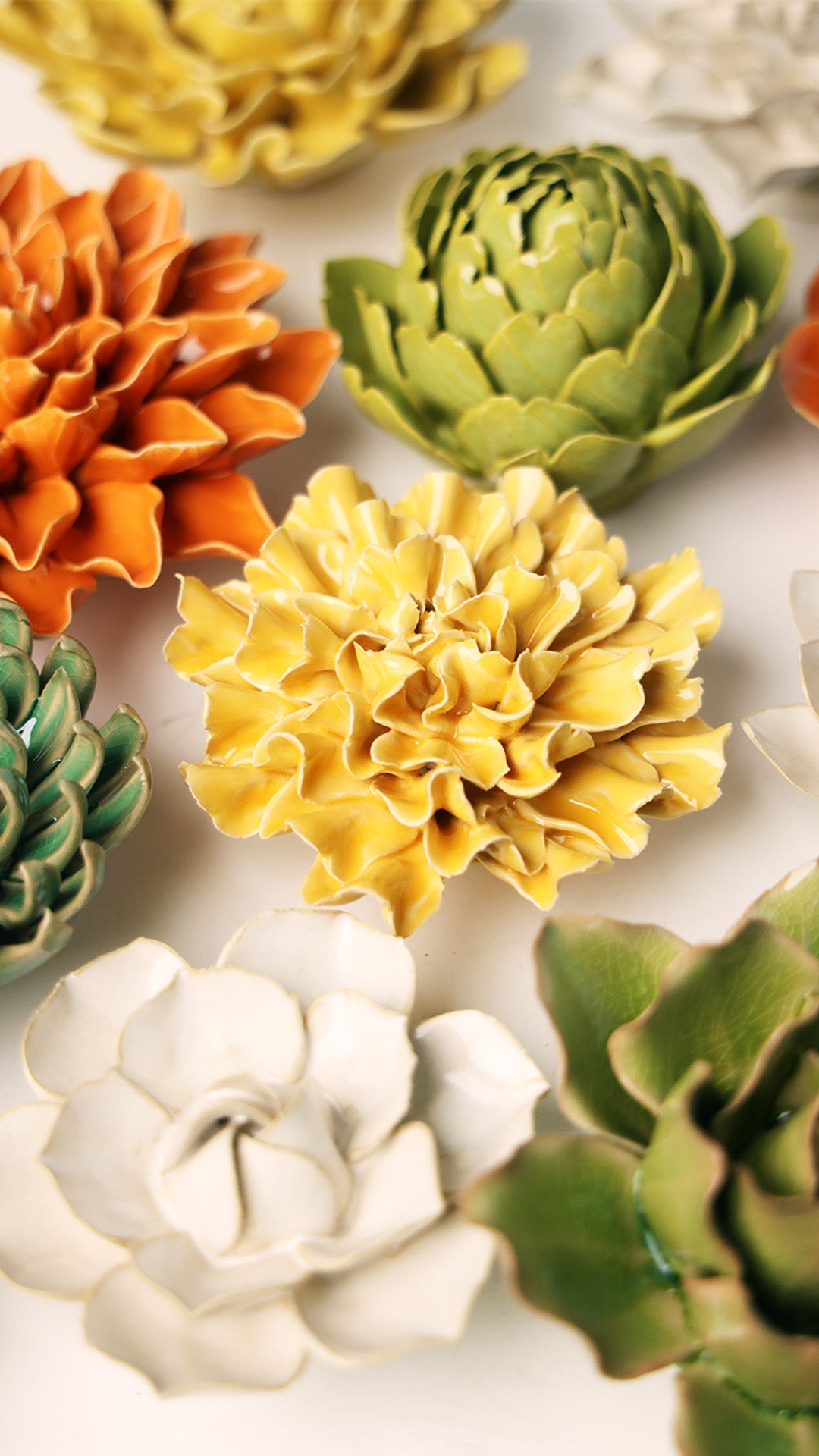 Burnt Yellow Tundra Carnation ceramic wall flower styled on wall — English Garden — Chive Studio Toronto