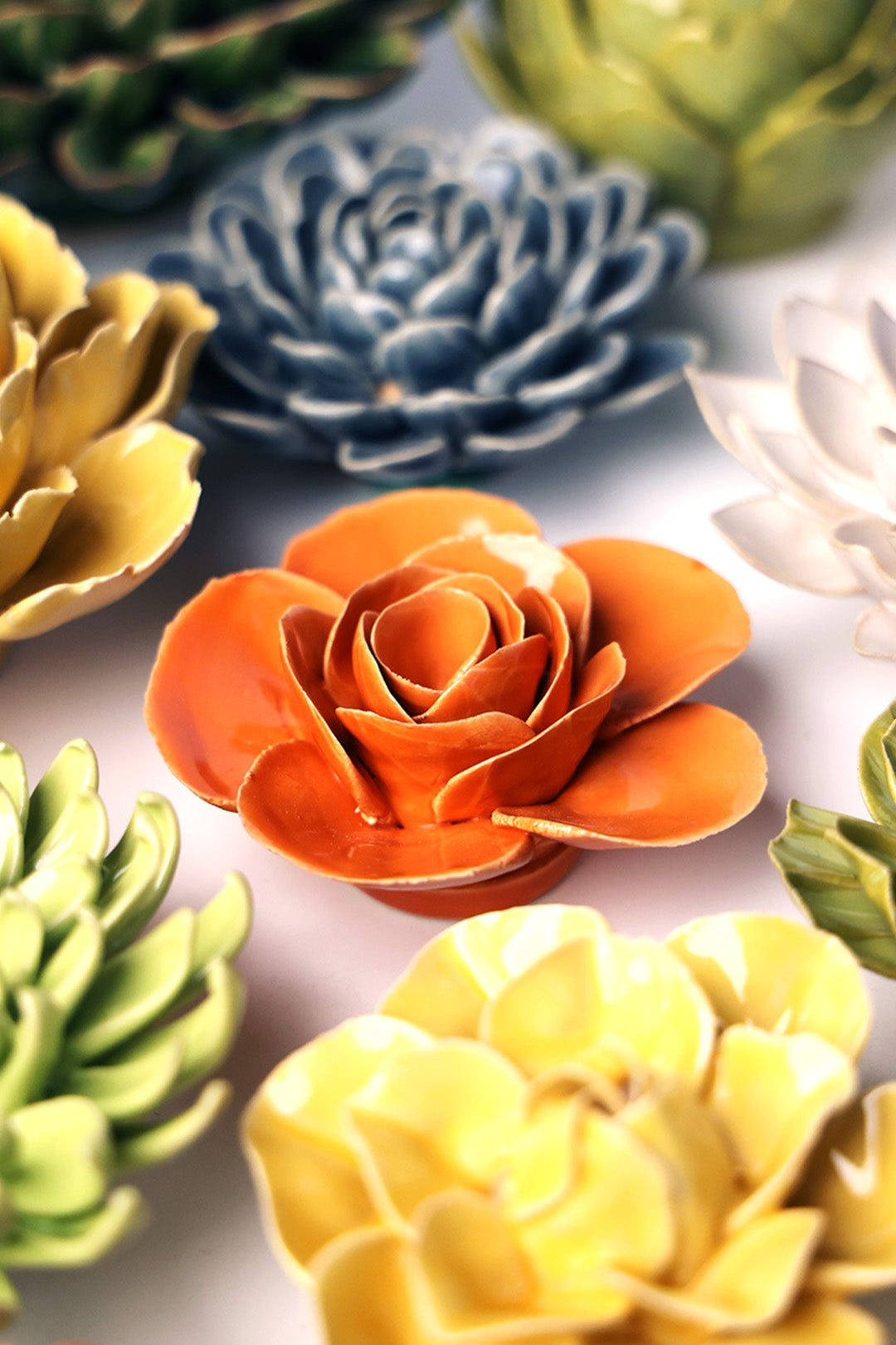 Orange Elegance Ranunculus ceramic wall flower styled on wall — English Garden — Chive Studio Toronto