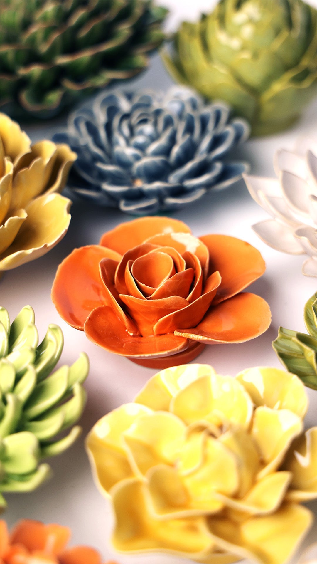 Orange Elegance Ranunculus ceramic wall flower styled on wall — English Garden — Chive Studio Toronto