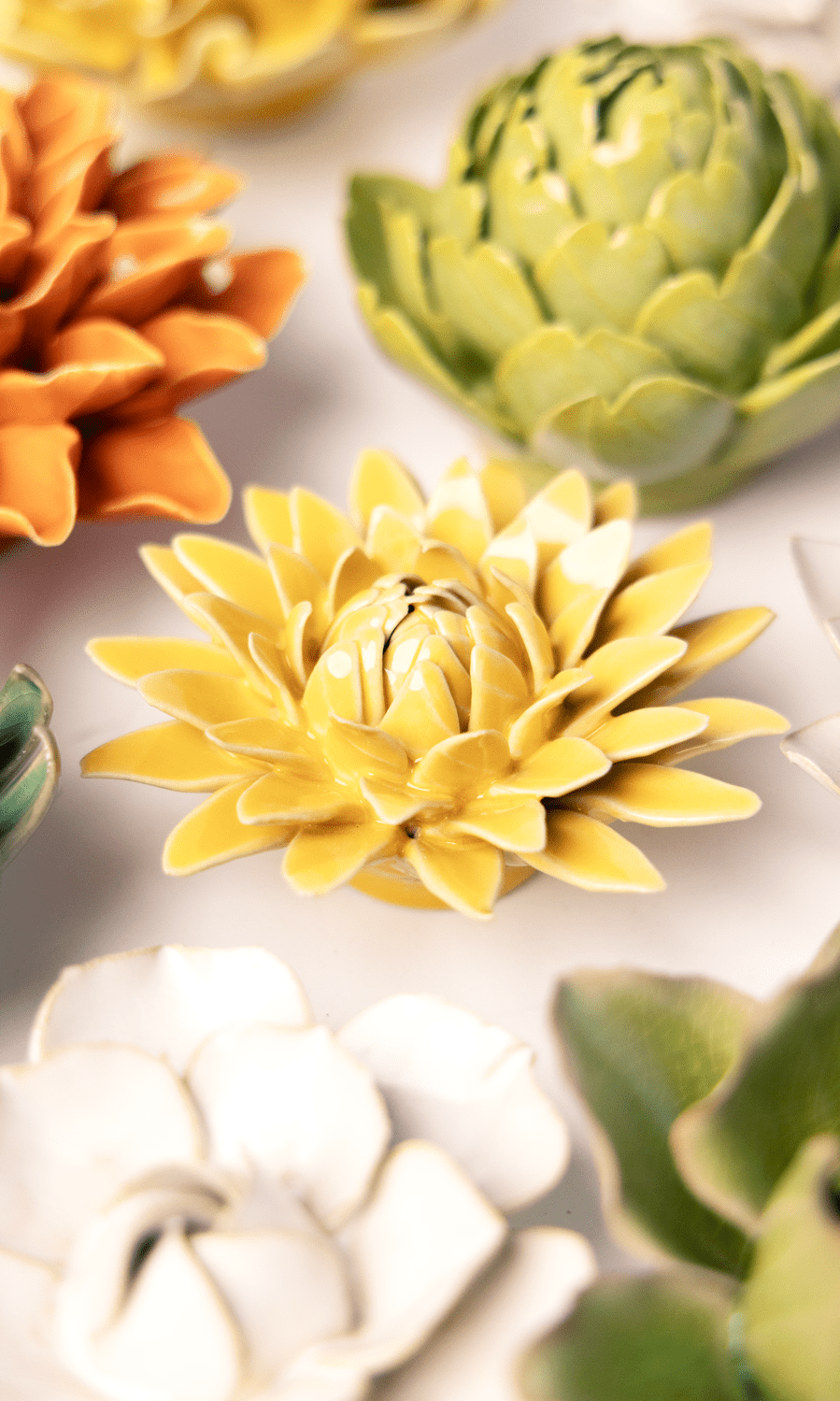 Burnt Yellow Strawflower ceramic wall flower styled on wall — English Garden — Chive Studio Toronto
