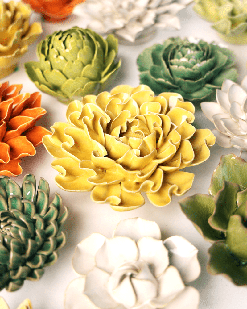 Buttercup Yellow Hawthorn ceramic wall flower mounted on a wall — Chive Ceramics Studio