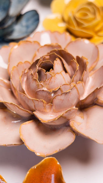 Rose Pink Camellia ceramic wall flower mounted on a wall — Chive Ceramics Studio