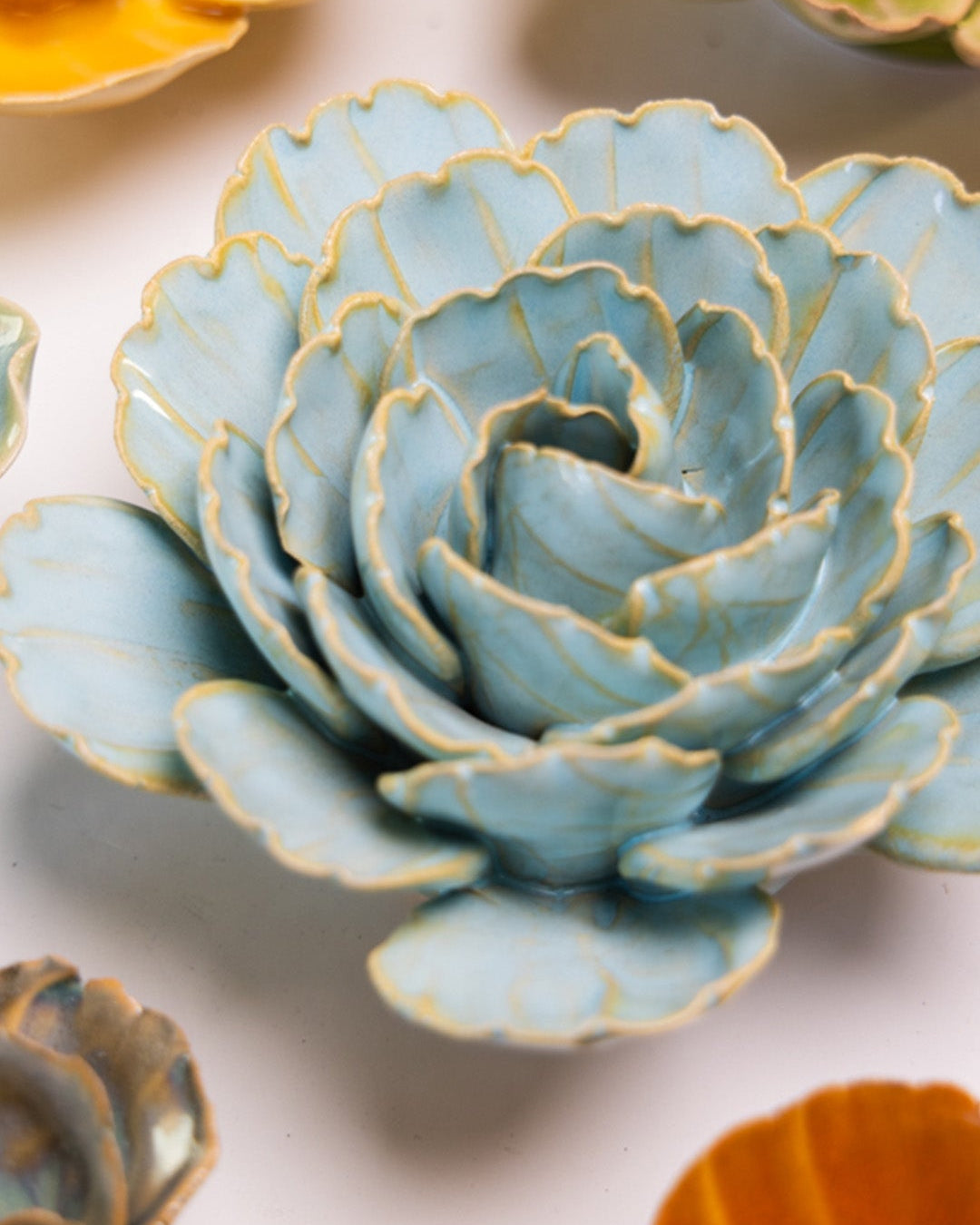 Robin's Egg Blue Keiko Peony mounted on a bedroom wall, Chive Ceramics Studio