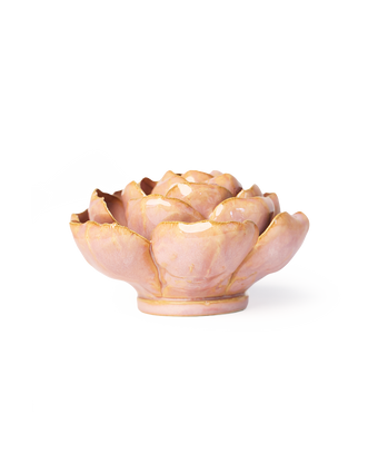 A glossy pink ceramic lotus-shaped dish with gold metallic accents along the petal edges, set against a plain white background.