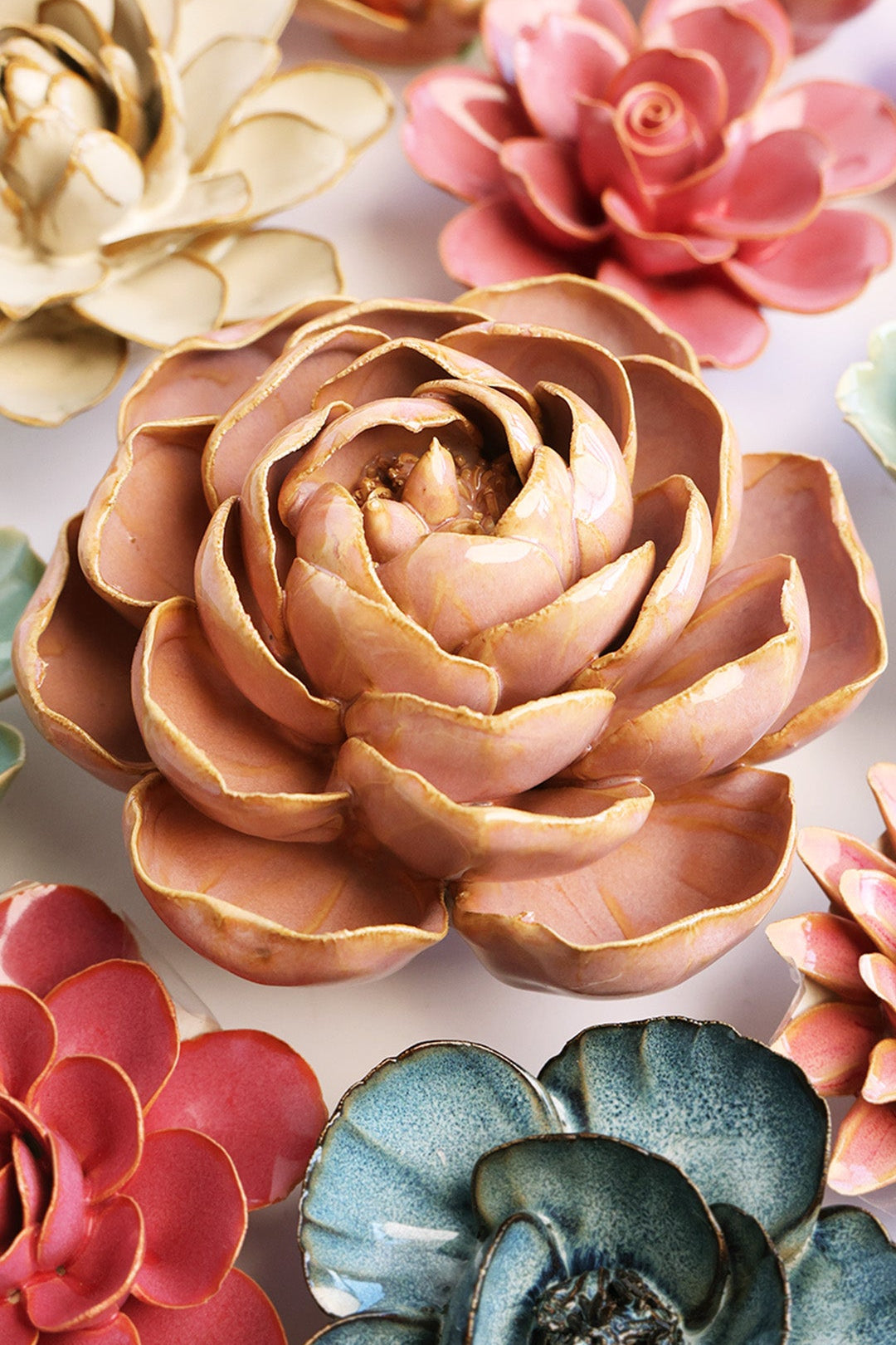 Rose Pink Peony ceramic wall flower styled on a white table with other flowers — Chive Studio