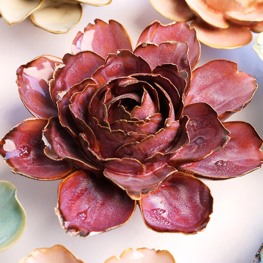 Dewberry Camellia ceramic wall flower mounted on a wall — Chive Ceramics Studio