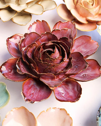 Dewberry Camellia ceramic wall flower mounted on a wall — Chive Ceramics Studio